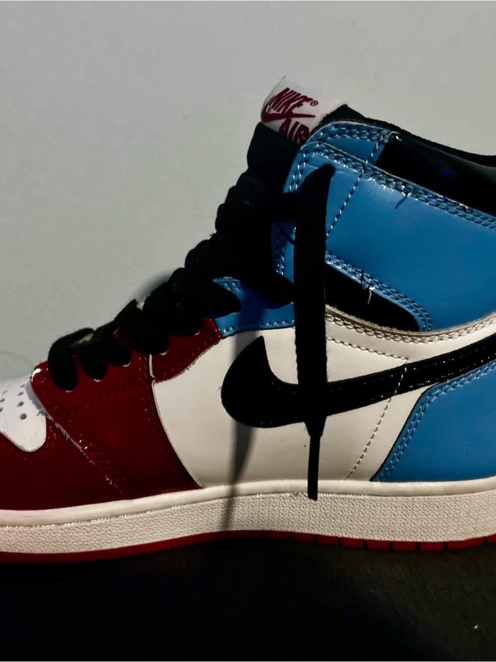 Nike Jordan 1 High-Top Sneaker in Red White Blue with Black Swoosh